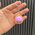 🥟 Porte-clés Anti-stress en Forme de Ravioli – Avec Lumière LED Tactile | Fidget Toy de Poche | 6 Couleurs | Idée Cadeau Originale ✨🎁